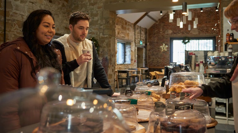 A couple in a winter visit to the Brewhouse Cafe at Seaton Delaval Hall Northumberland